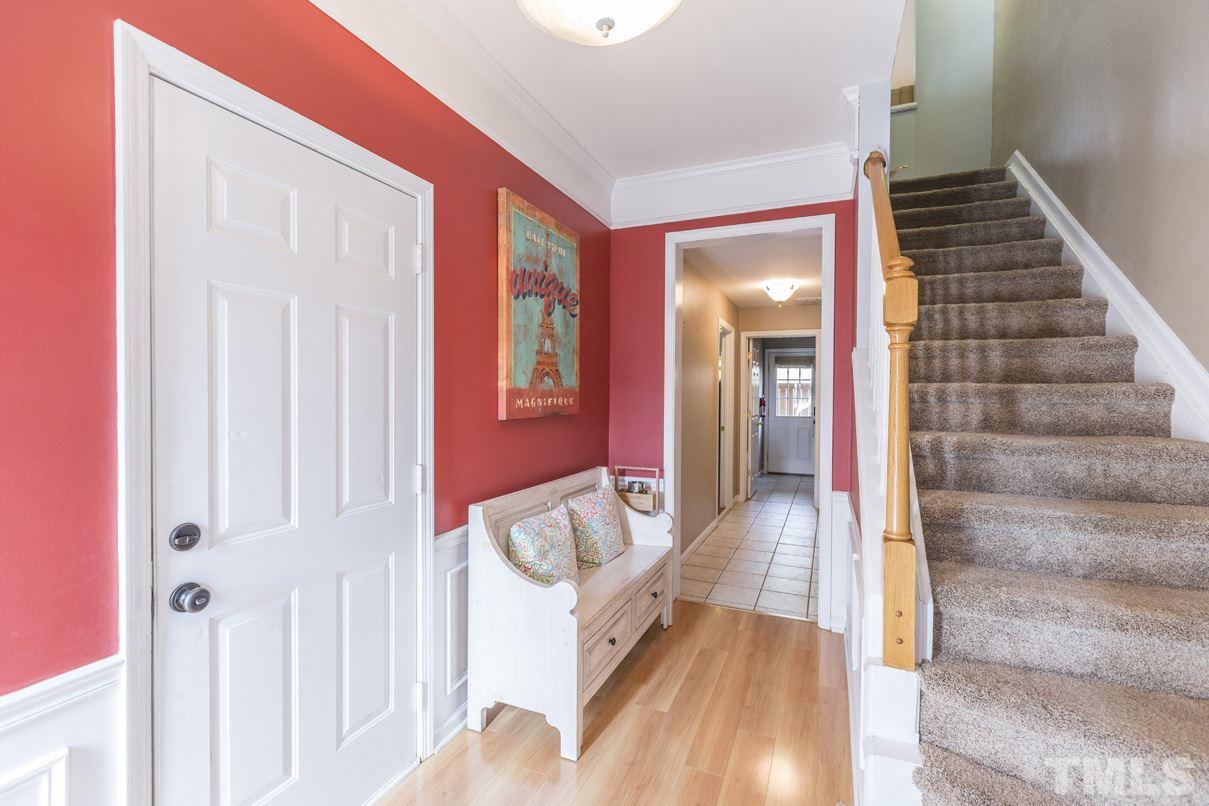 5524 Red Robin Road Raleigh, NC 27613 - Photo 3 of 24 a view of an entryway with wooden floor and door