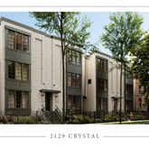 a view of a large brick building next to a yard