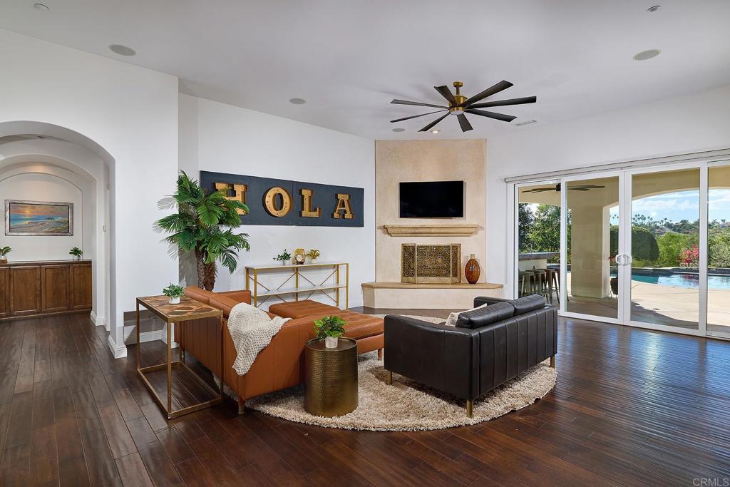 2869 Dos Lomas Place Fallbrook, CA 92028 - Photo 16 of 55 a living room with furniture fireplace and flat screen tv