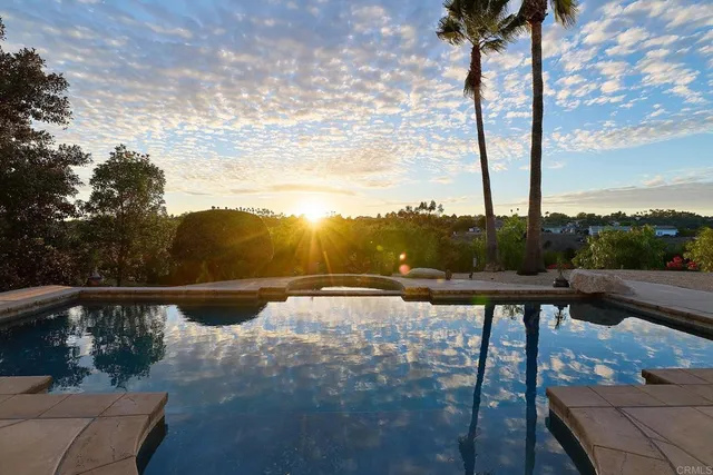 a view of swimming pool with lounge chair