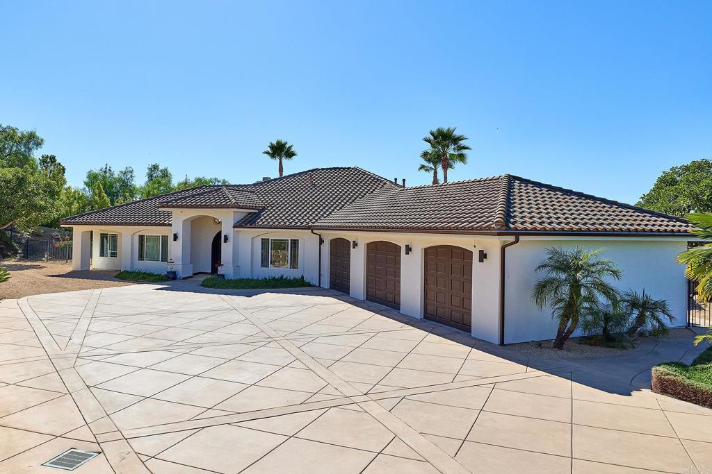 2869 Dos Lomas Place Fallbrook, CA 92028 - Photo 26 of 55 a front view of a house with a yard and a garage
