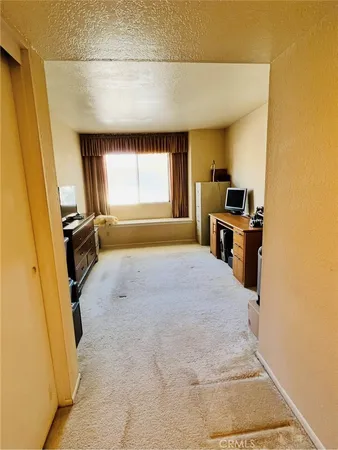 a room with a bed and furniture