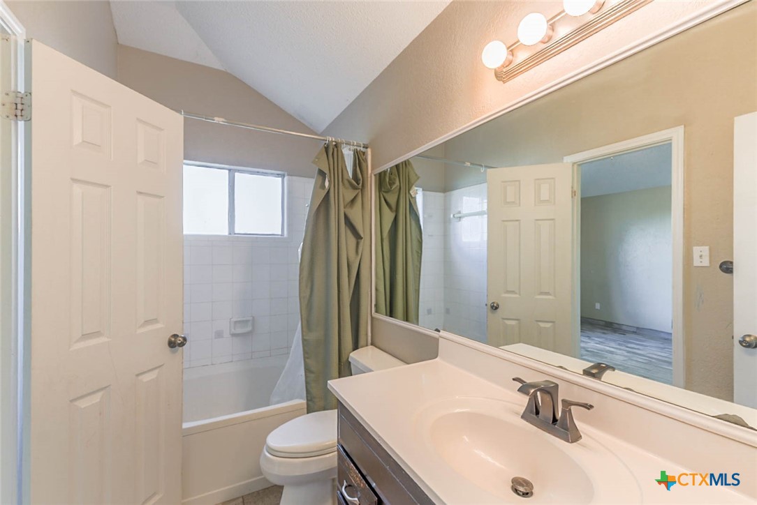 2305 Fieldstone Drive Killeen, TX 76549 - Photo 11 of 18 a bathroom with a sink toilet and shower
