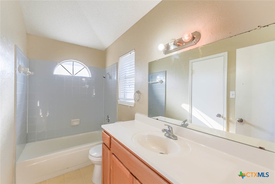 2305 Fieldstone Drive Killeen, TX 76549 - Photo 14 of 18 a bathroom with a sink and a mirror