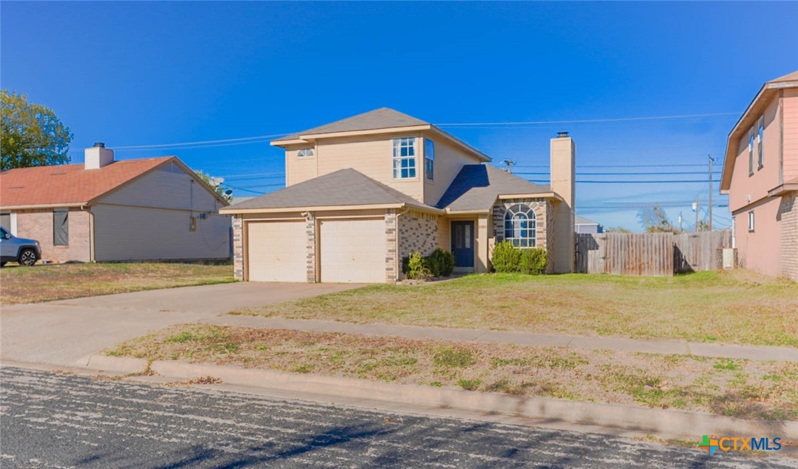 2305 Fieldstone Drive Killeen, TX 76549 - Photo 2 of 18 a front view of a house with a yard