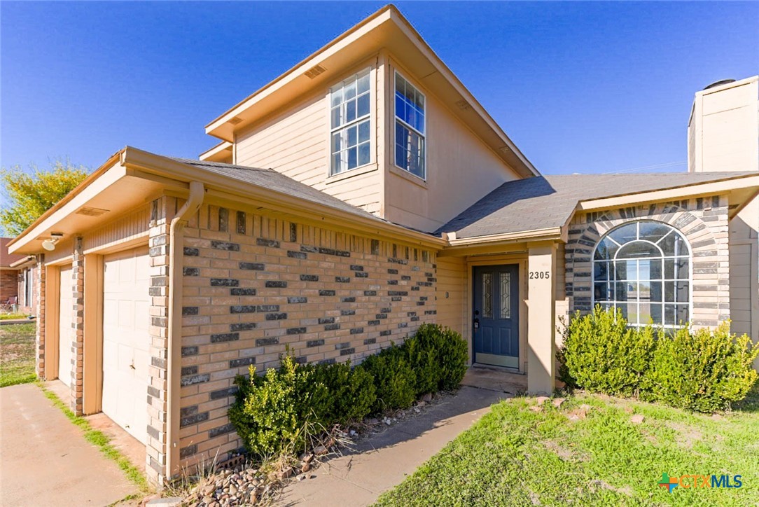 2305 Fieldstone Drive Killeen, TX 76549 - Photo 3 of 18 a view of a house with a yard