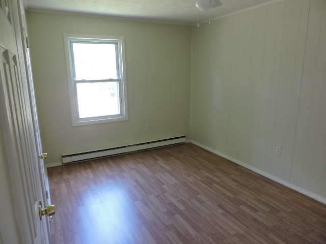 828 Augusta Farms Road Waynesboro, VA 22980 - Photo 8 of 14 an empty room with wooden floor and windows