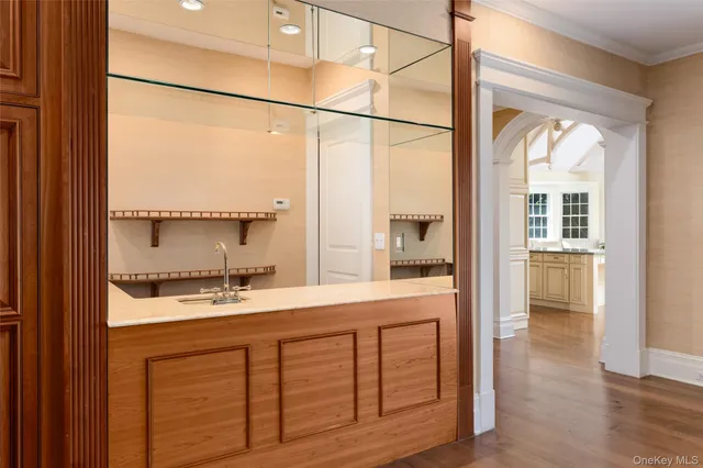 a bathroom with a sink a mirror and a shower