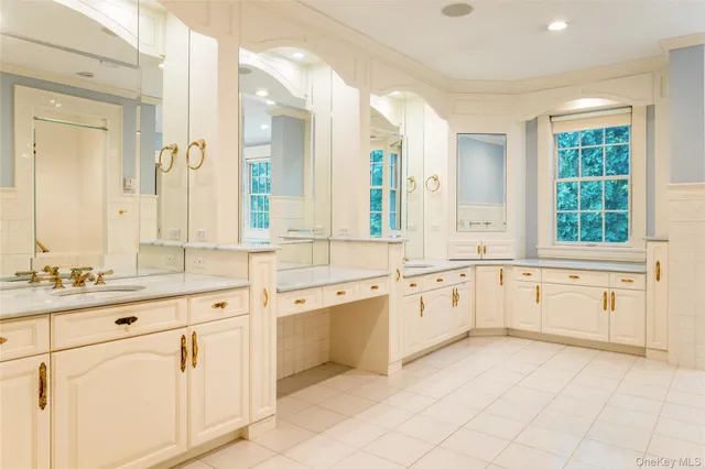 a large white cabinets with a large window