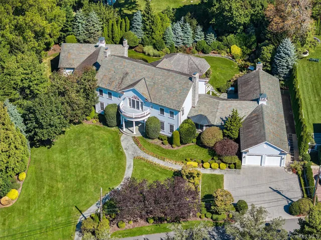 an aerial view of a house with a garden