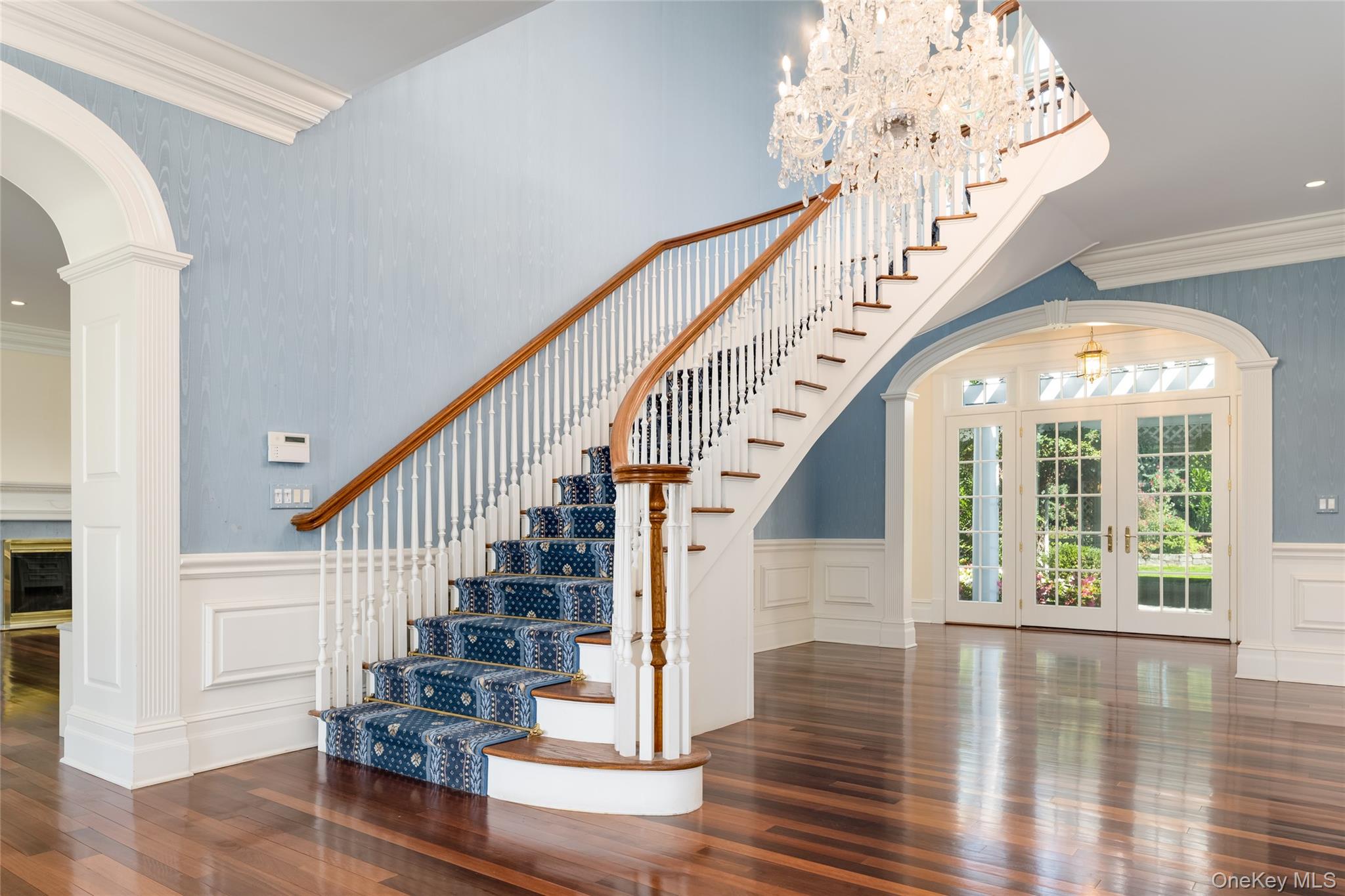 63 Premium Point New Rochelle, NY 10801 - Photo 5 of 24 Sweeping Staircase thru to rear Gardens