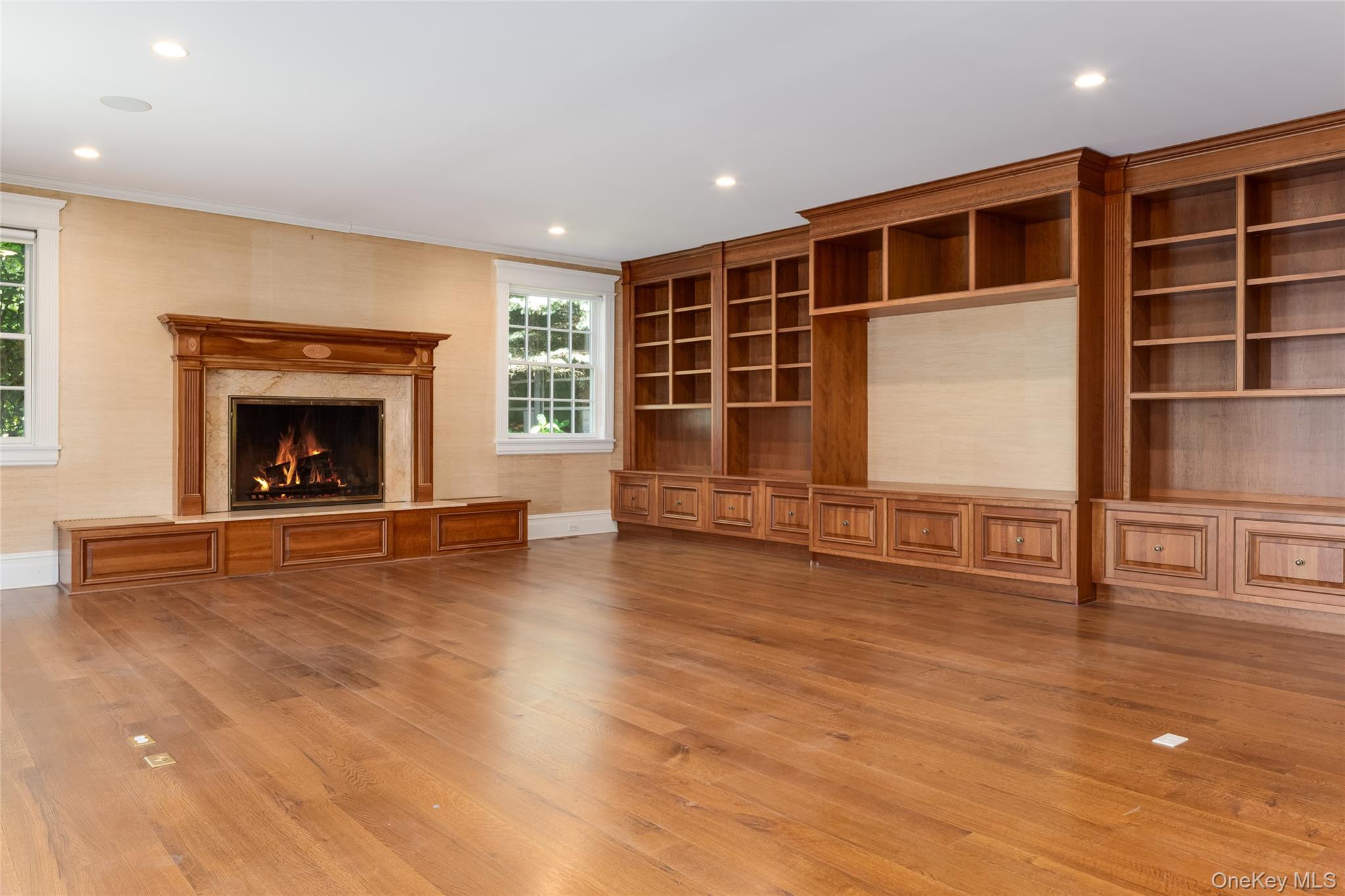 63 Premium Point New Rochelle, NY 10801 - Photo 10 of 24 Family Room w/Gas Fireplace & French Doors to Garden