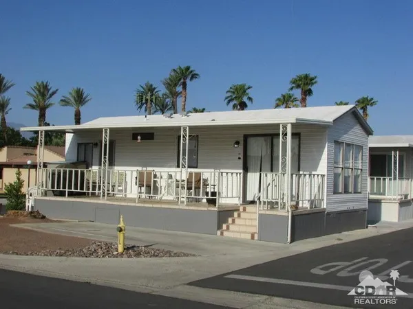 a front view of a house with a porch