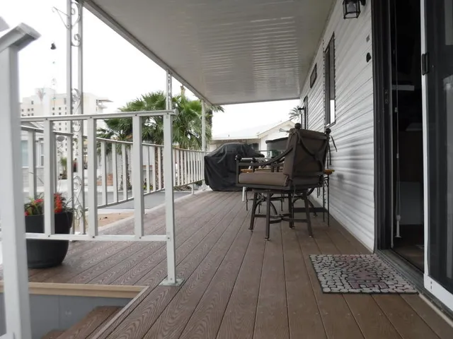 a table and chairs in a balcony