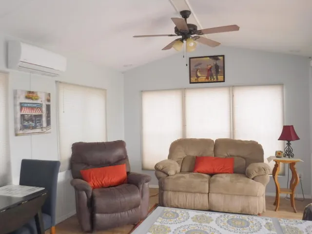 a living room with furniture and a window
