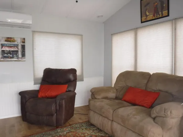 a living room with furniture and a window