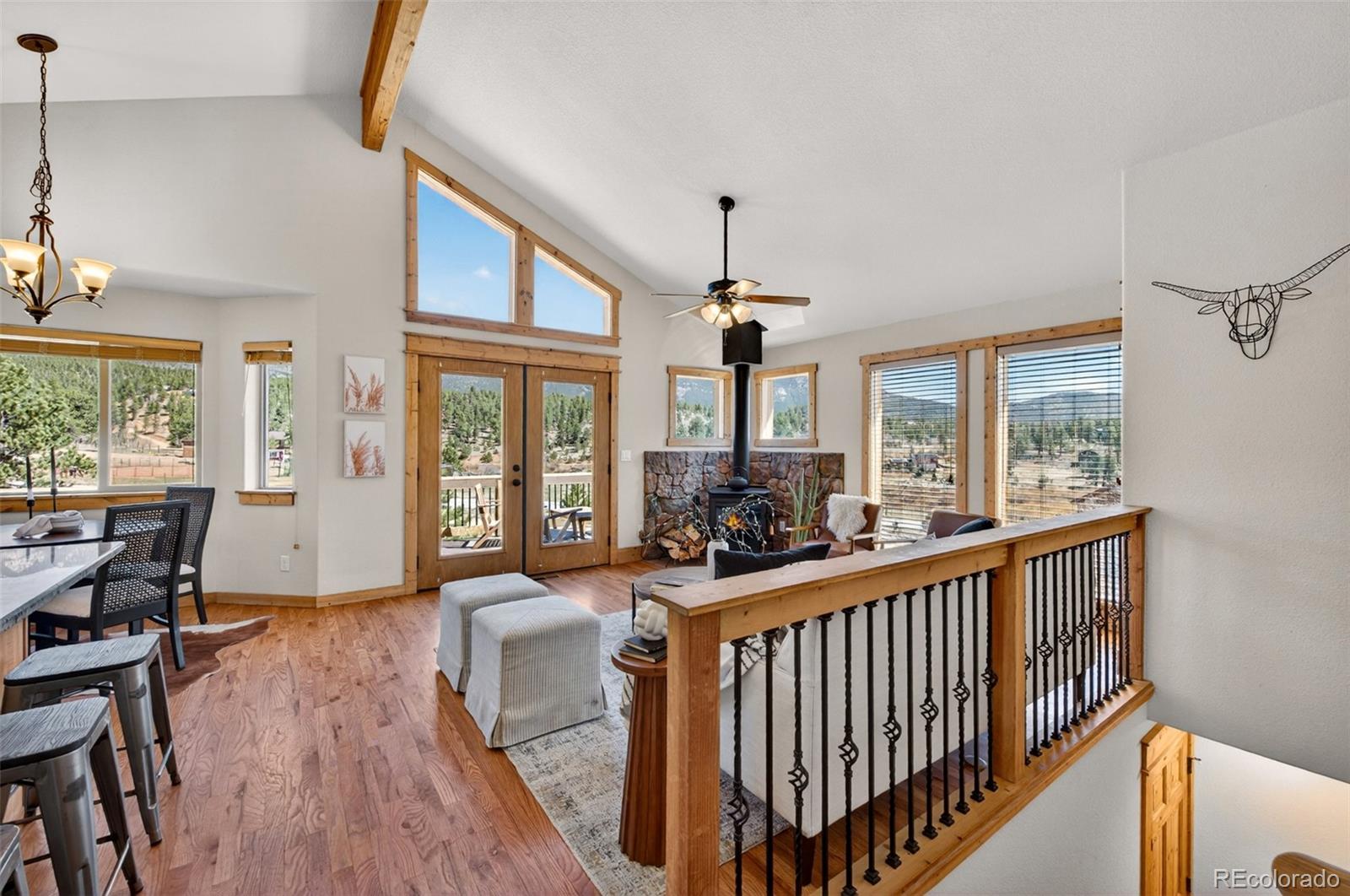 1328 Clark Road Bailey, CO 80421 - Photo 11 of 48 a view of a dining room with furniture window and wooden floor