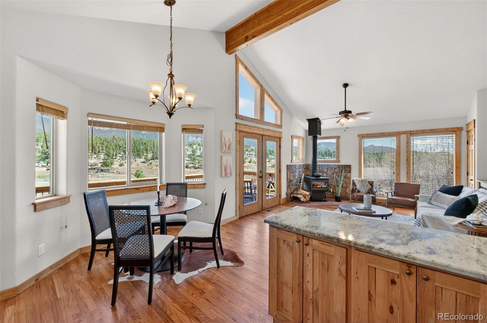 1328 Clark Road Bailey, CO 80421 - Photo 17 of 48 a view of a dining room with furniture window and outside view
