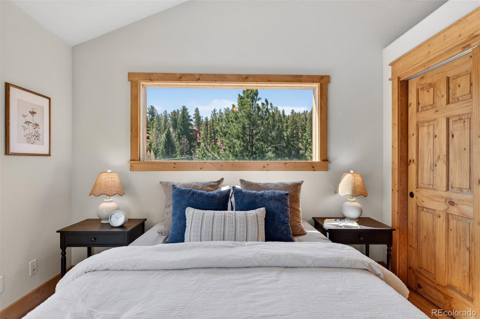 1328 Clark Road Bailey, CO 80421 - Photo 20 of 48 a bedroom with bed and window