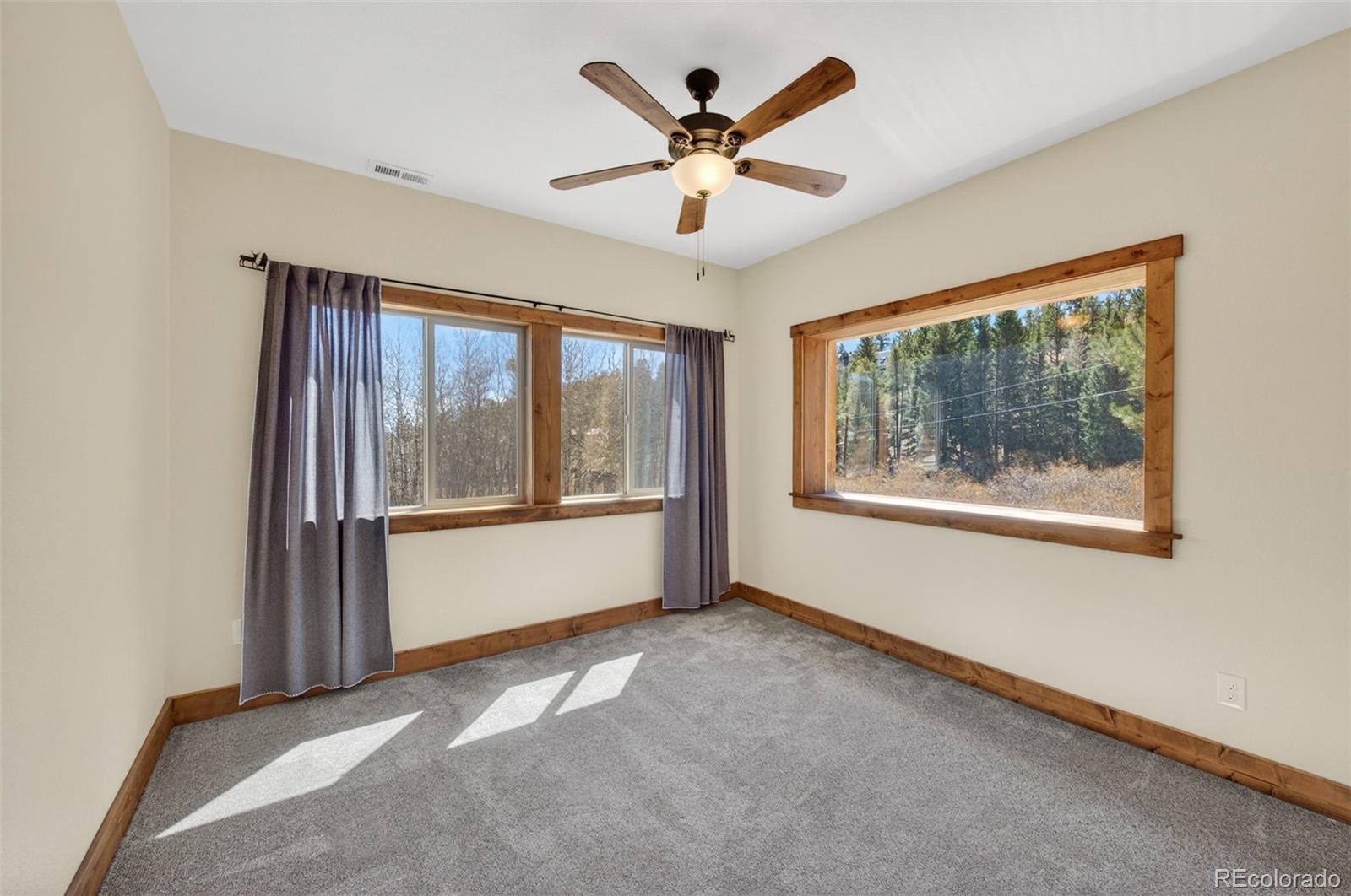 1328 Clark Road Bailey, CO 80421 - Photo 27 of 48 a view of an empty room with a window