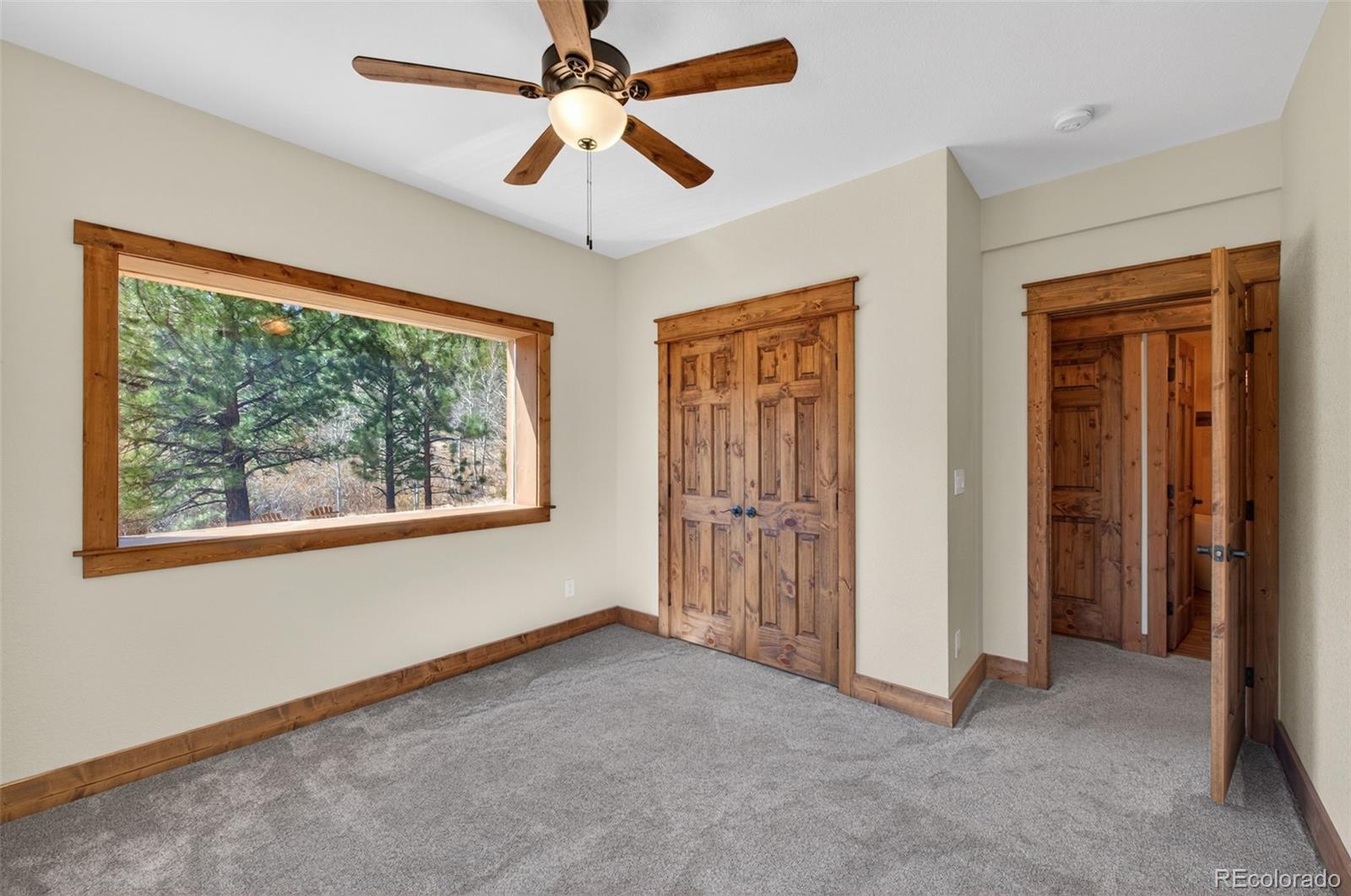 1328 Clark Road Bailey, CO 80421 - Photo 28 of 48 wooden floor in an empty room with a window