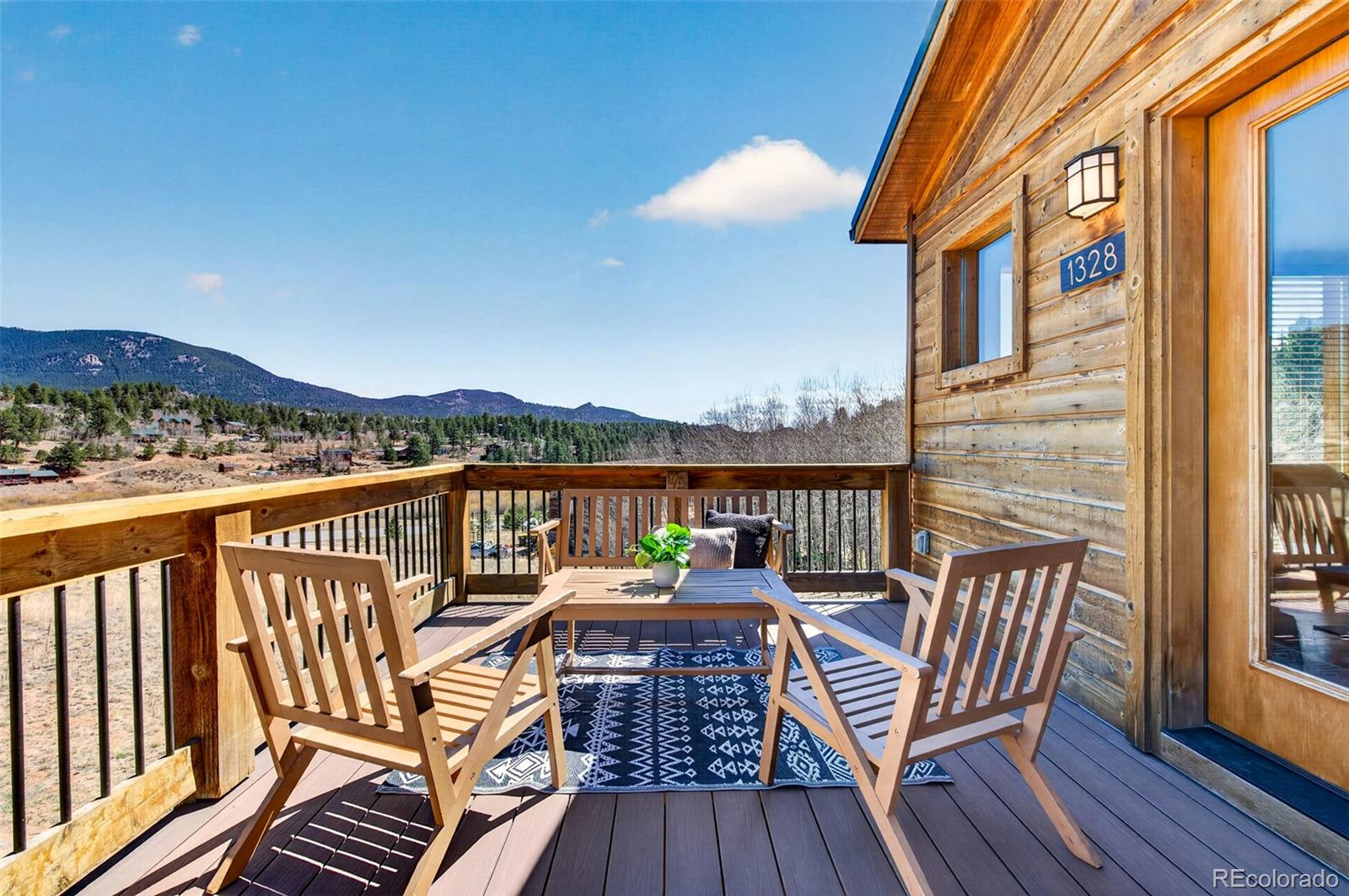 1328 Clark Road Bailey, CO 80421 - Photo 4 of 48 a view of a balcony with outdoor seating