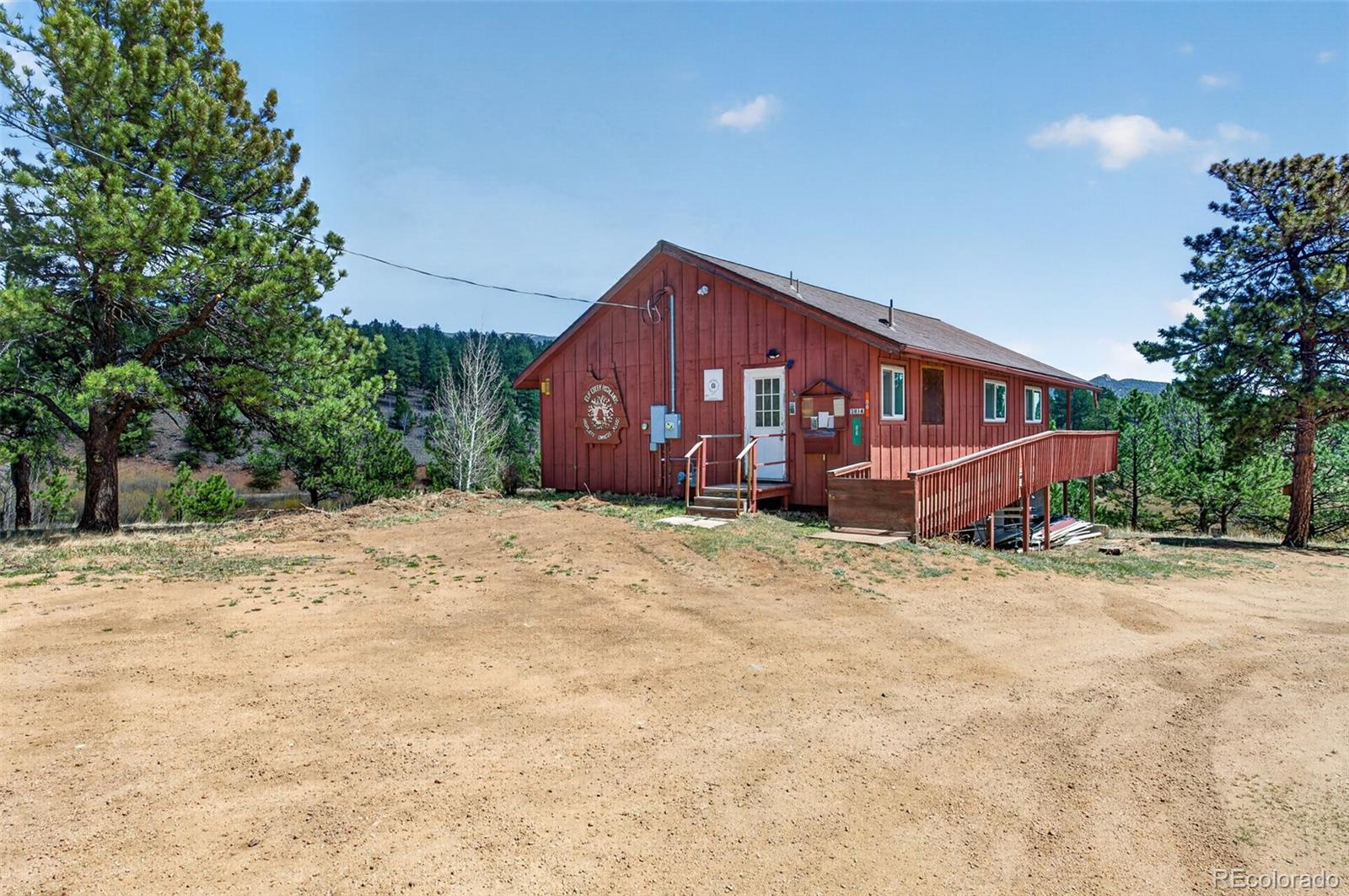 1328 Clark Road Bailey, CO 80421 - Photo 45 of 48 a view of a house with a yard