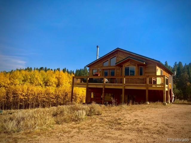 1328 Clark Road Bailey, CO 80421 - Photo 47 of 48 a view of a house with a yard