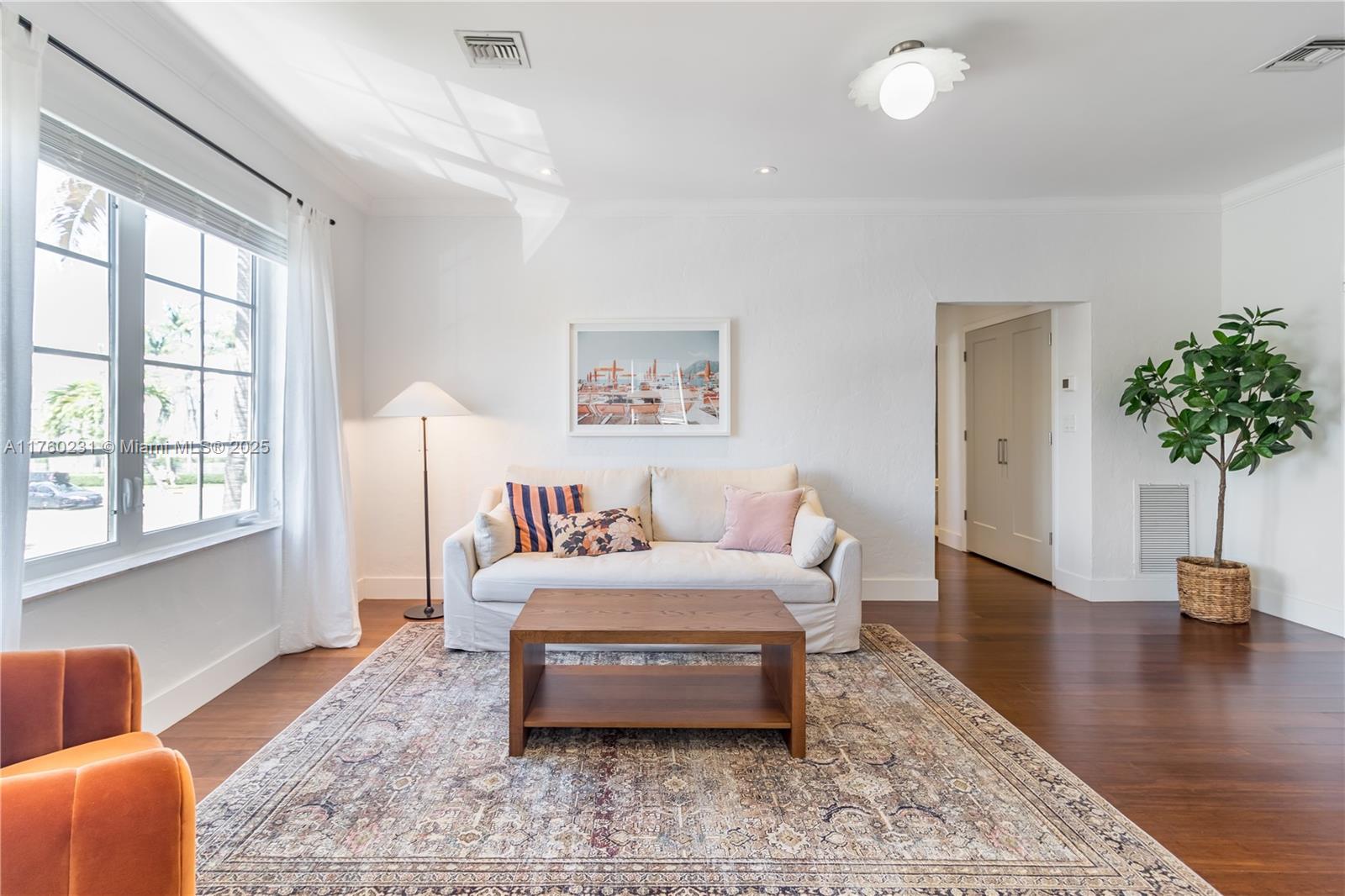 a bedroom with furniture and a potted plant