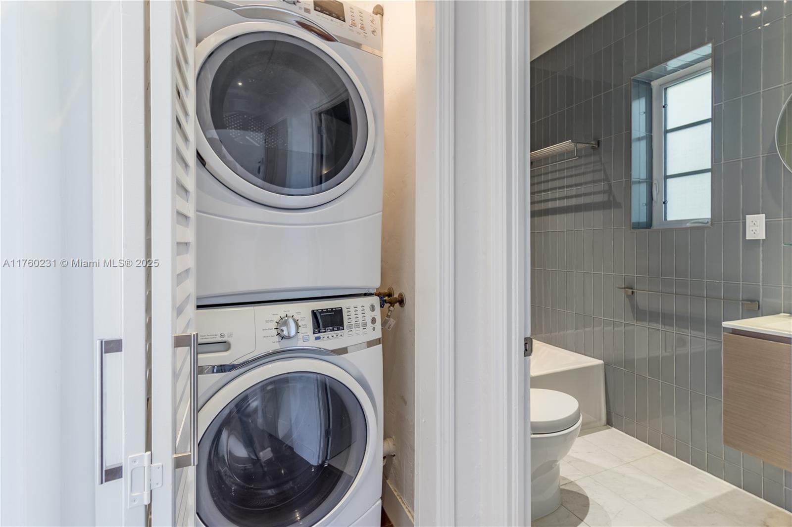 1569 Euclid Avenue, Unit 3 Miami Beach, FL 33139 - Photo 11 of 20 a view of a bathroom with a washer and dryer