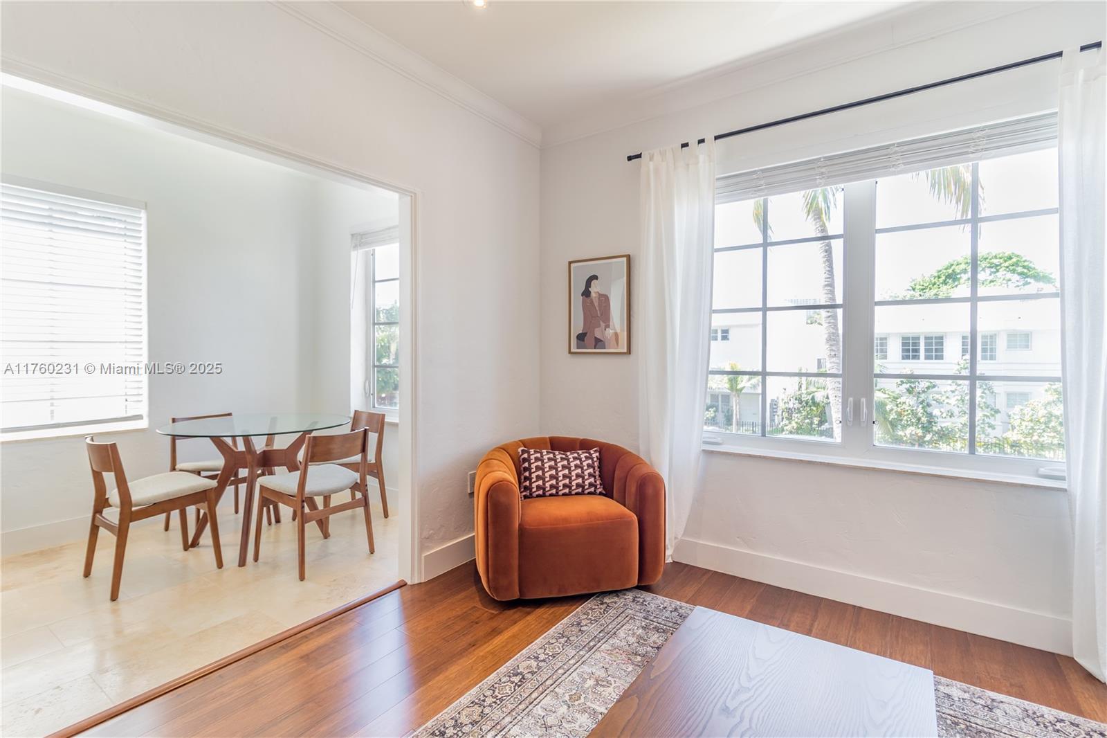 1569 Euclid Avenue, Unit 3 Miami Beach, FL 33139 - Photo 17 of 20 a living room with furniture and a window