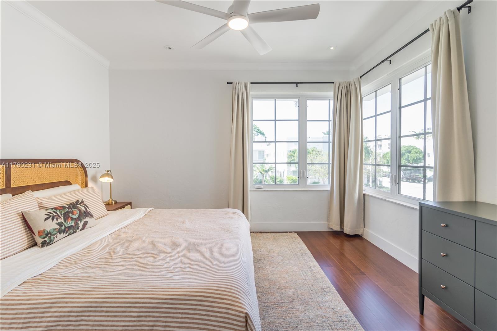 1569 Euclid Avenue, Unit 3 Miami Beach, FL 33139 - Photo 2 of 20 a bedroom with a bed and a large window