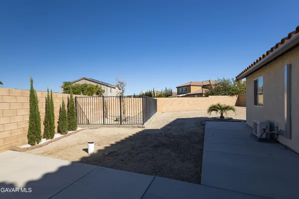 a view of a house with backyard floor and a window