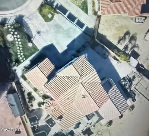 an aerial view of a house with wooden floor