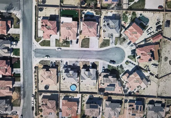 an aerial view of a building with retail shops