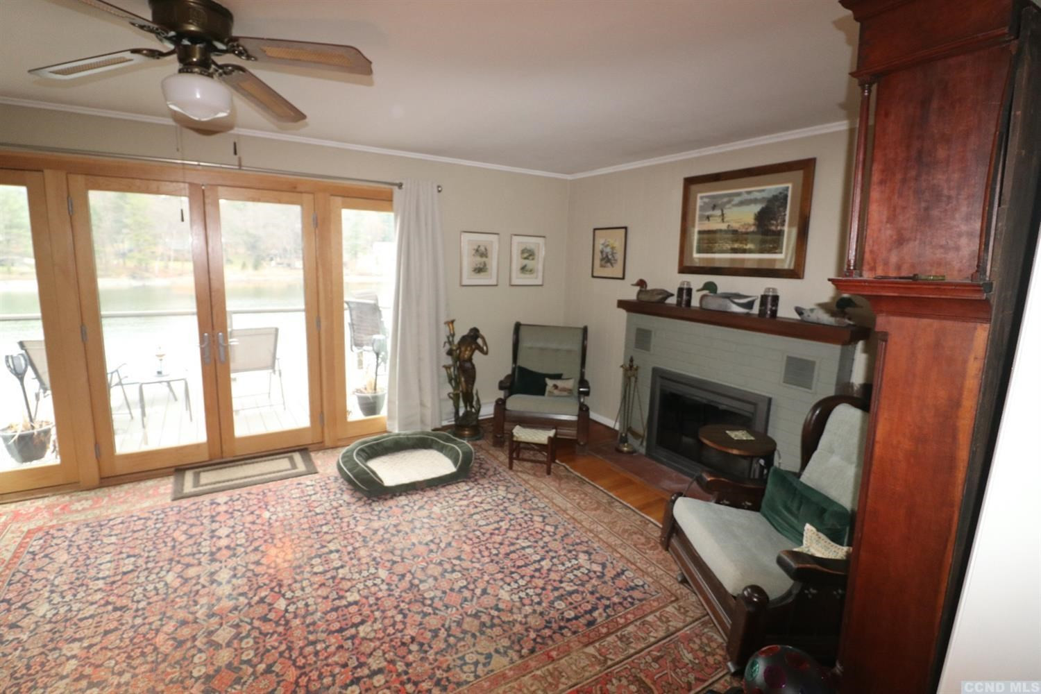 1238 Lakeview Road Copake, NY 12516 - Photo 22 of 54 a living room with furniture a large window and a fireplace