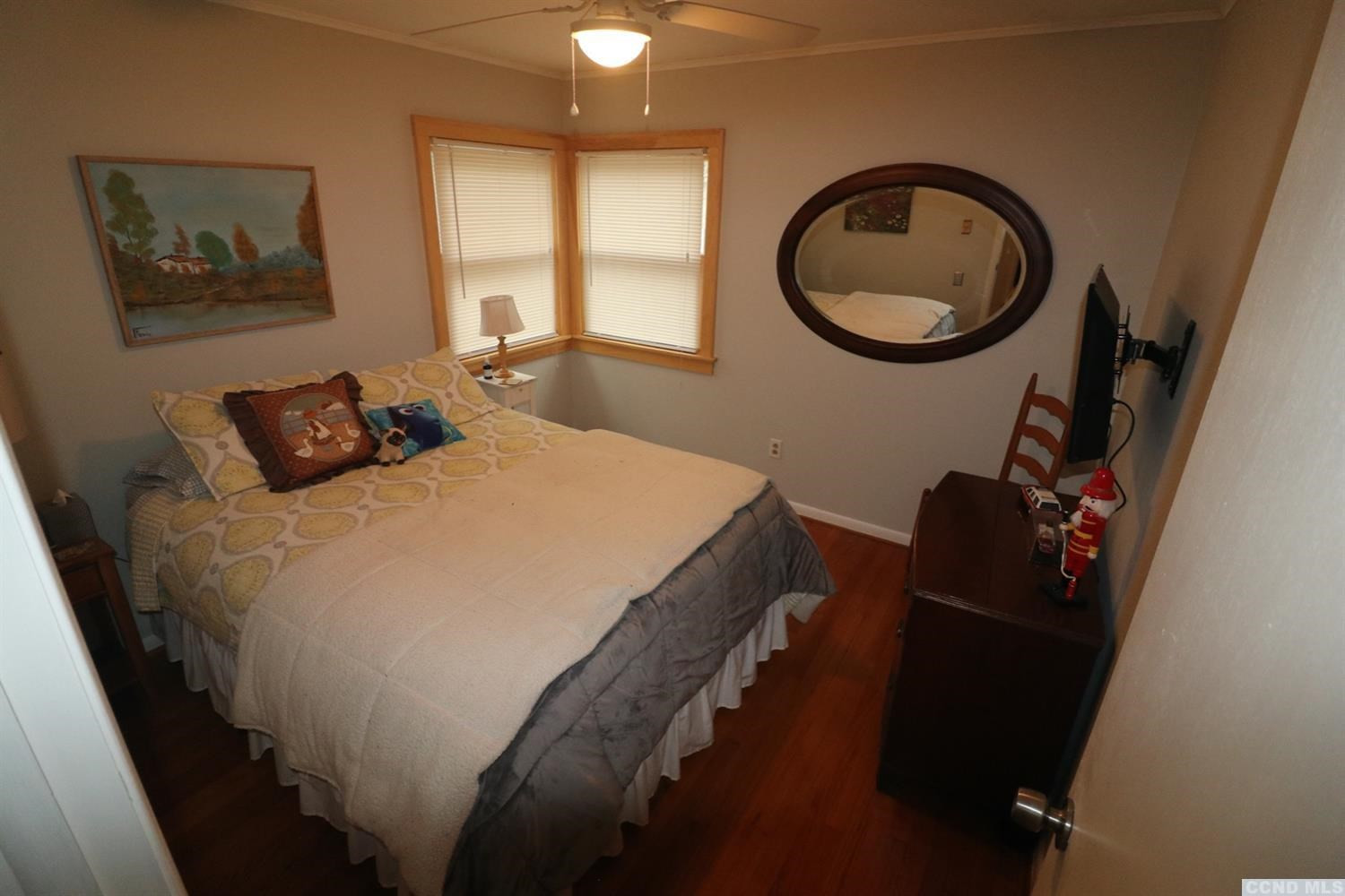 1238 Lakeview Road Copake, NY 12516 - Photo 33 of 54 a bedroom with a bed and a chandelier
