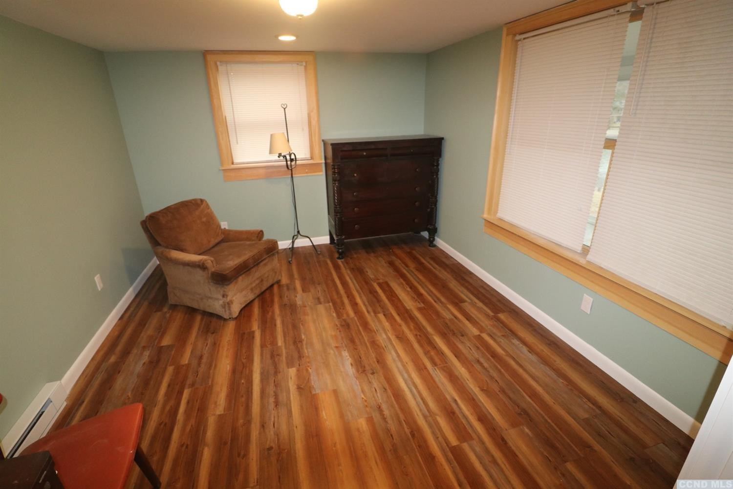 1238 Lakeview Road Copake, NY 12516 - Photo 38 of 54 a bedroom with a bed and chair