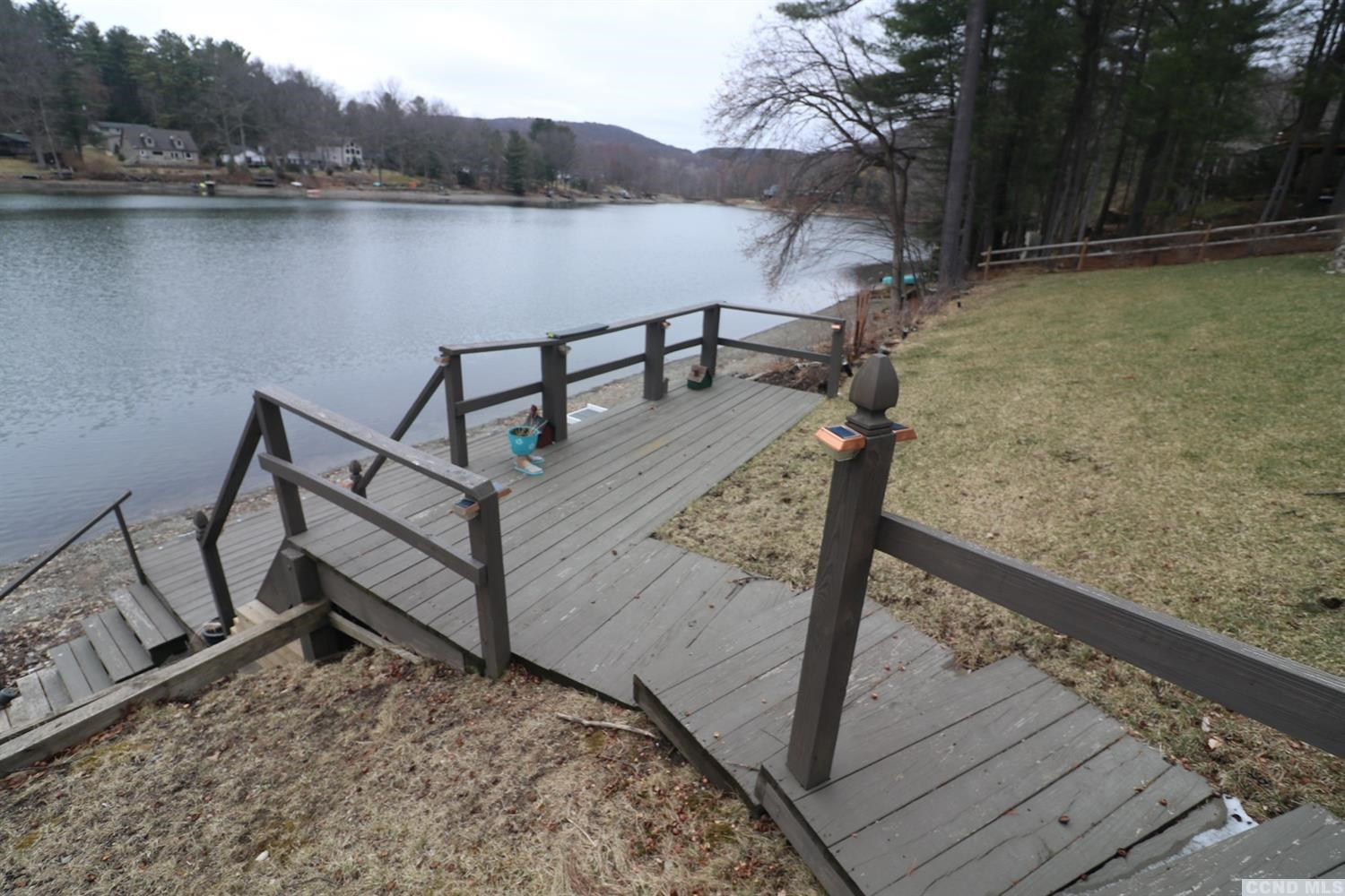 1238 Lakeview Road Copake, NY 12516 - Photo 8 of 54 a view of a bench on a lake