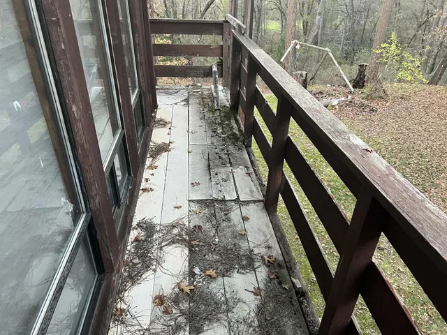 a view of balcony with wooden floor