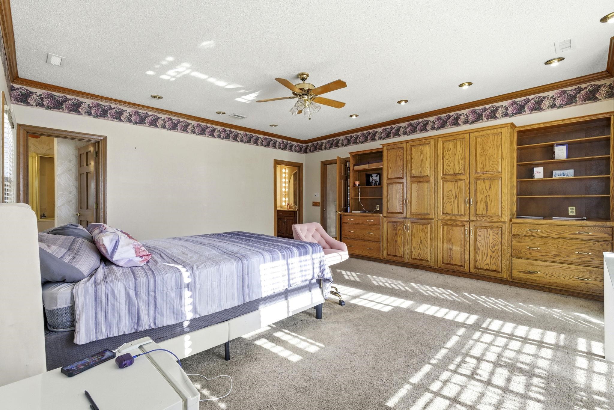 485 Carolina Drive Loris, SC 29569 - Photo 25 of 40 Bedroom with crown molding, light colored carpet, and ceiling fan