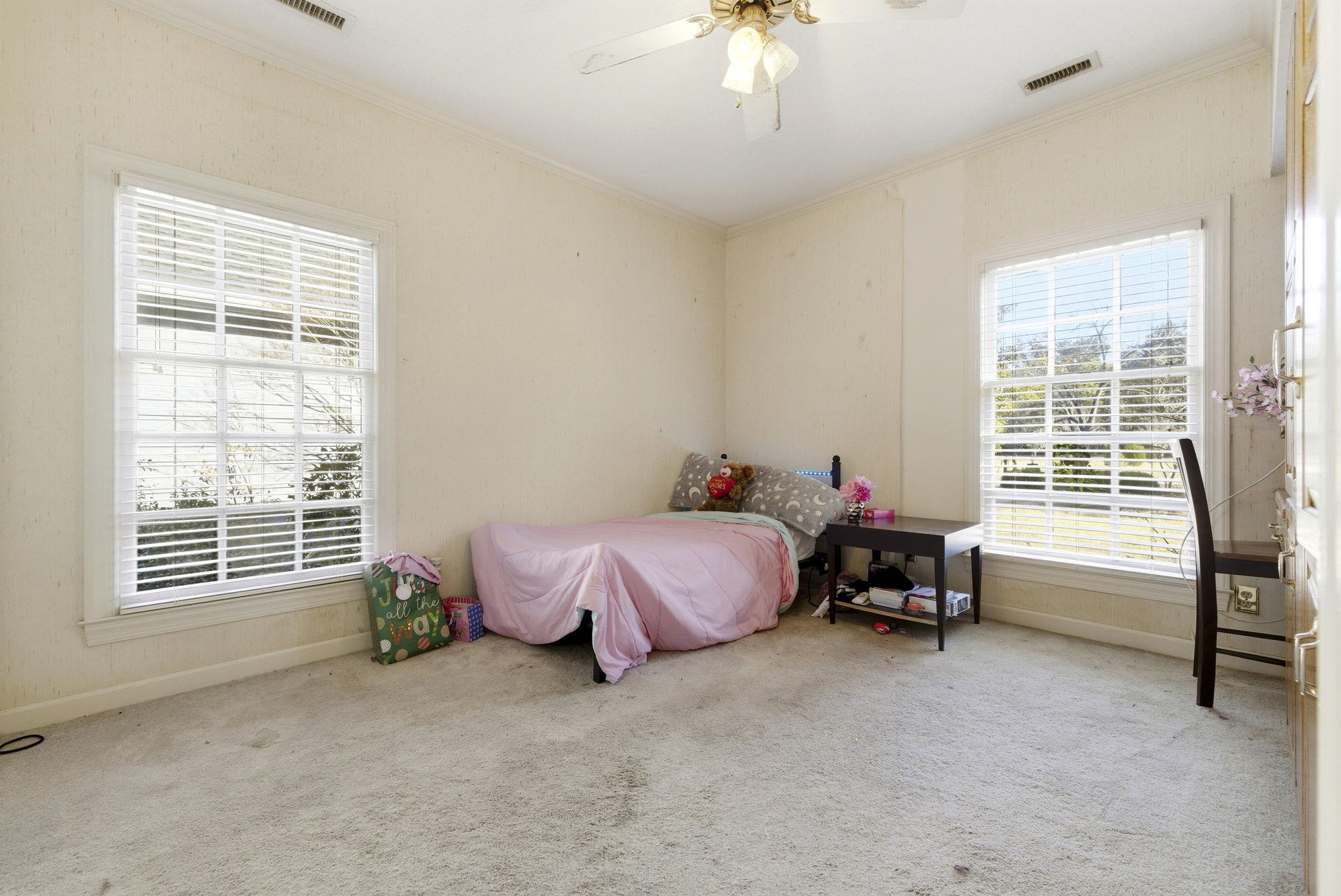 485 Carolina Drive Loris, SC 29569 - Photo 28 of 40 Carpeted bedroom with ornamental molding and ceiling fan
