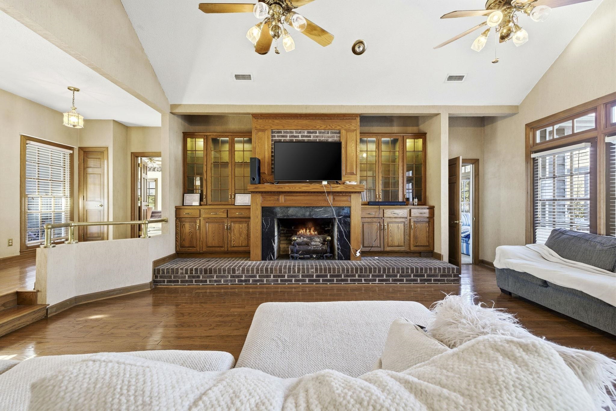 485 Carolina Drive Loris, SC 29569 - Photo 6 of 40 Living area with healthy amount of natural light, wood-type flooring, ceiling fan, and high vaulted ceiling