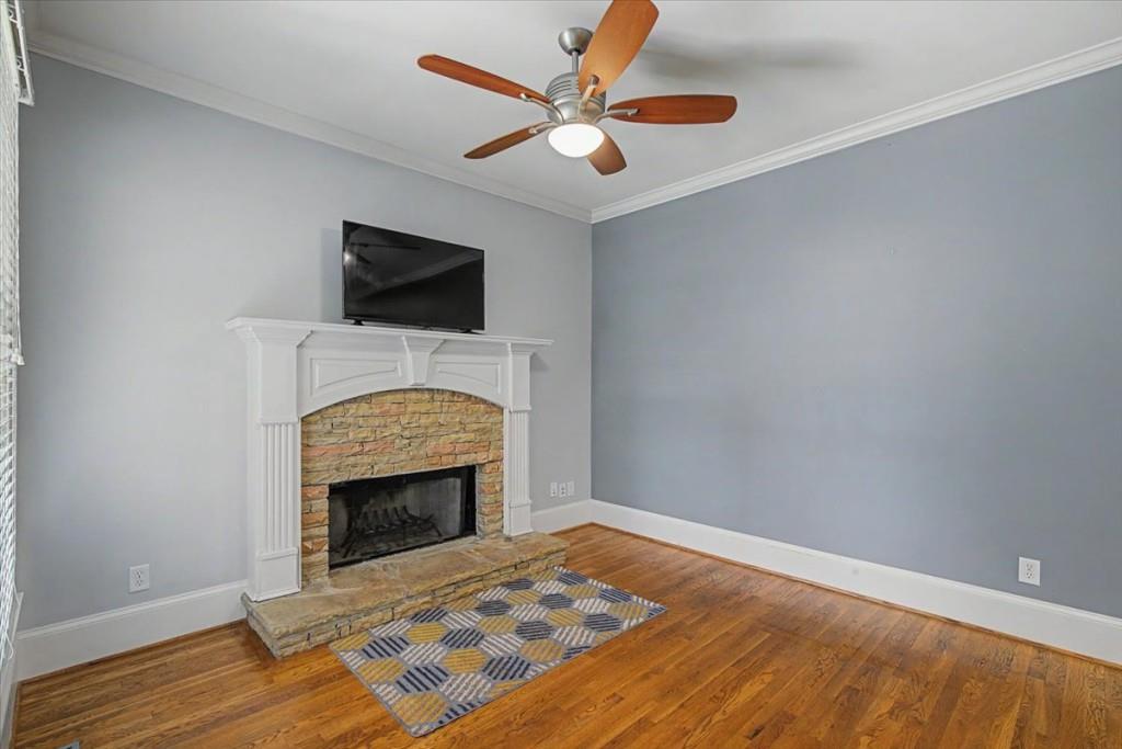 122 Ridge View Drive Ball Ground, GA 30107 - Photo 30 of 84 a bedroom with a fireplace and a ceiling fan