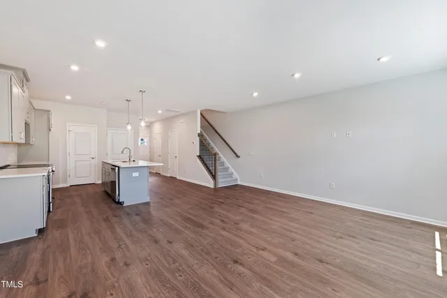 a view of kitchen with cabinets and wooden floor