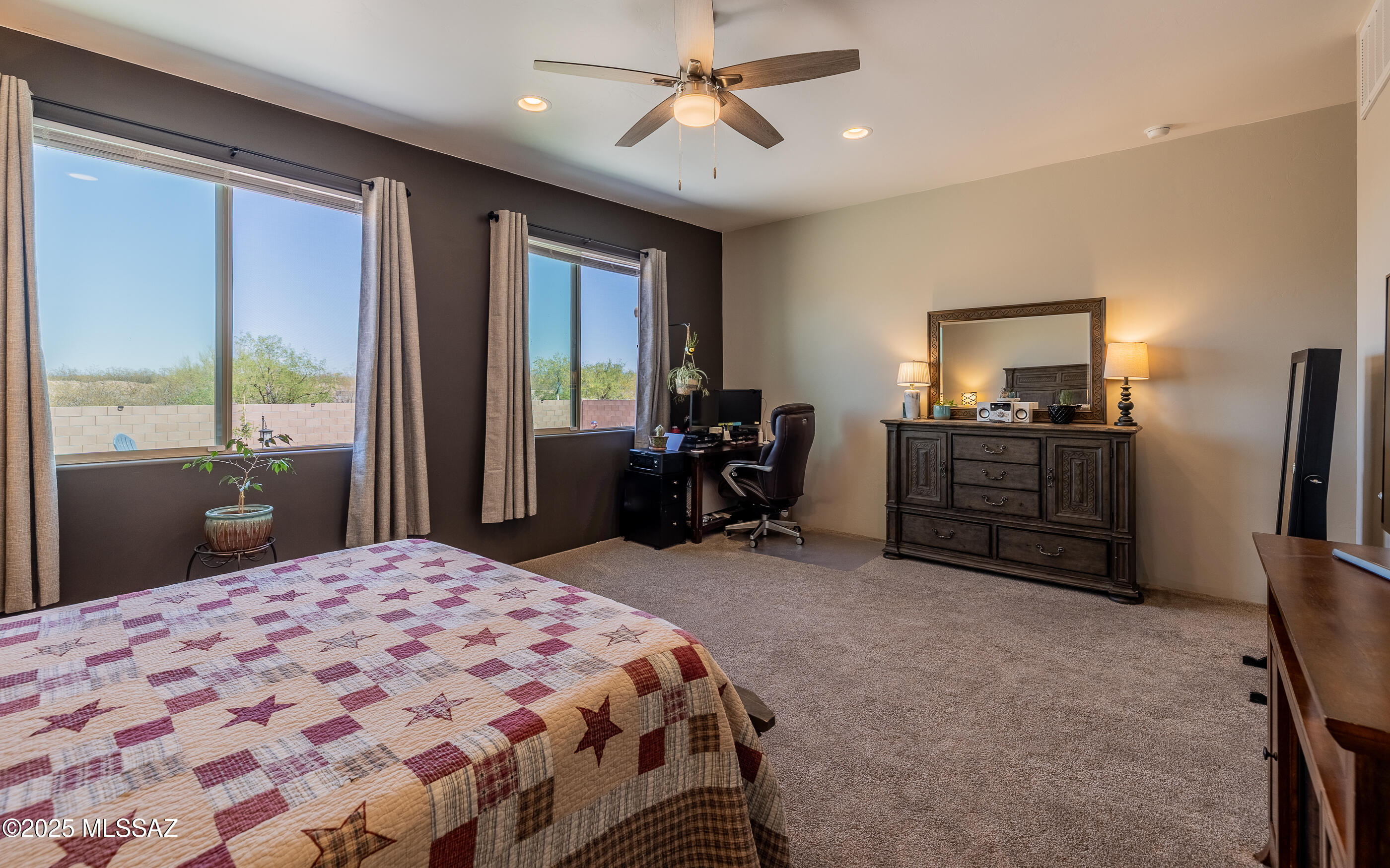 12123 Creosote Valley Road Vail, AZ 85641 - Photo 23 of 46 a bedroom with a bed dresser and a window