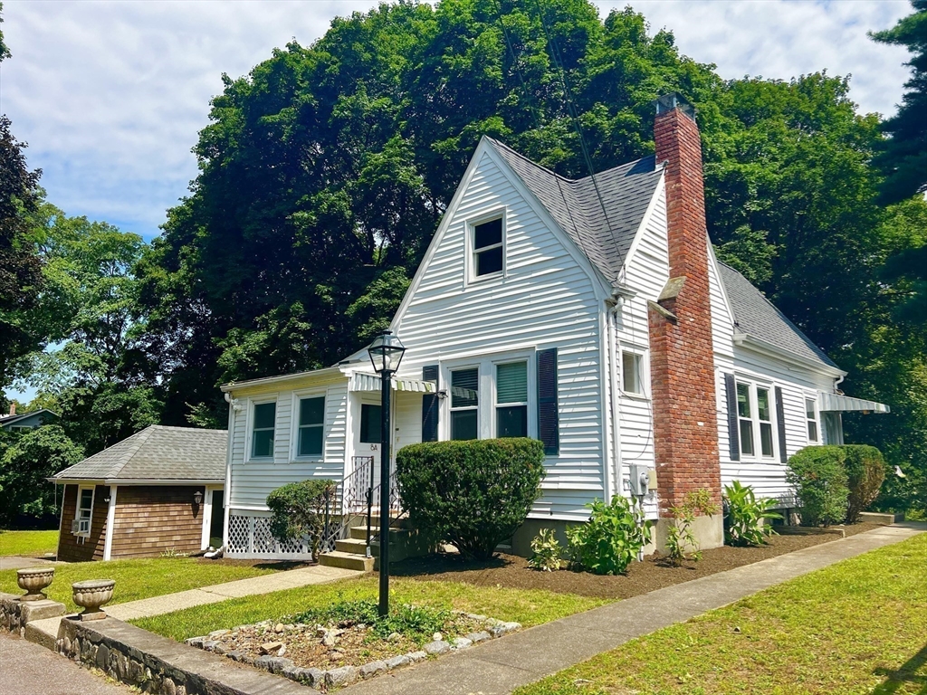 8 A Mellon Road Wellesley, MA 02482 - Photo 17 of 22 a front view of a house with a yard