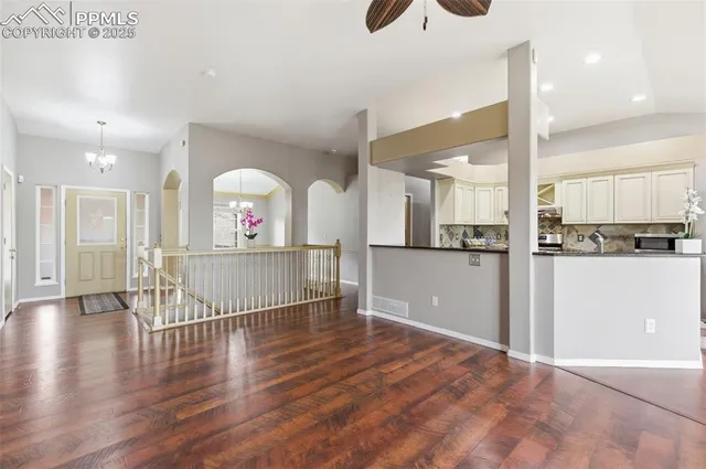 a view of a kitchen from a hallway