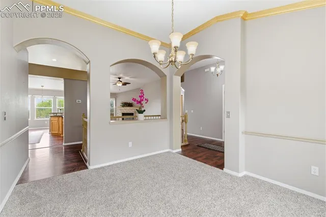 a view of a livingroom with kitchen and dining space