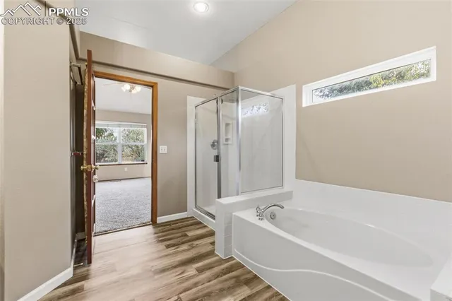 a bathroom with a bathtub and a shower